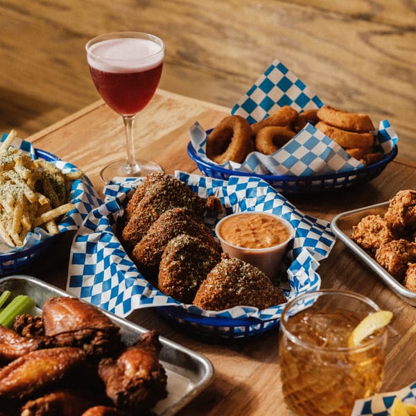Elsie Lane Huntington's American appetizers: fries, onion rings, fried mac and cheese, wings, and cocktails.